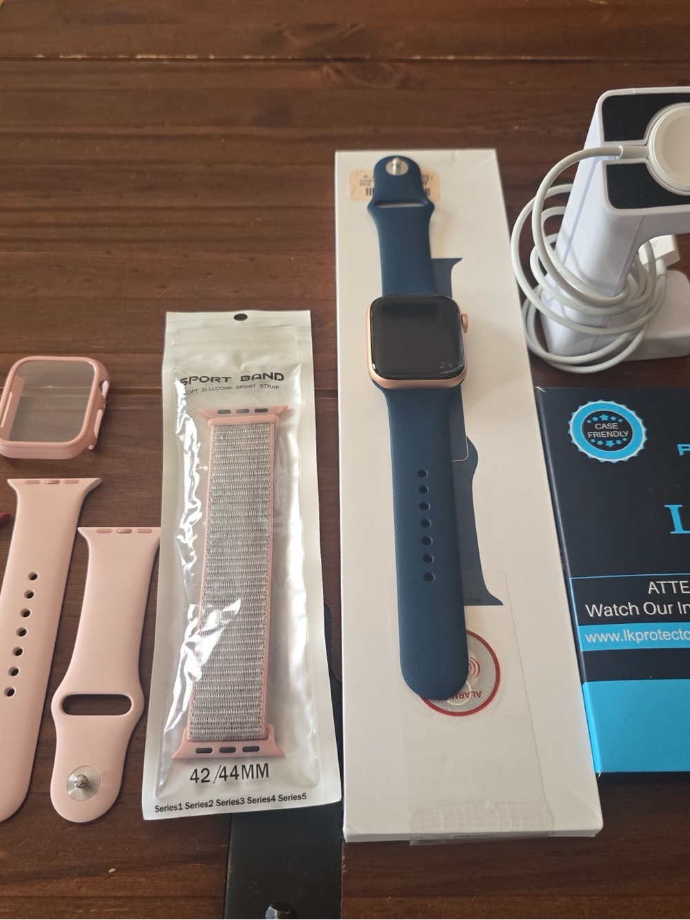 Apple Watch with Blue Sport Band and Pink Accessory Straps